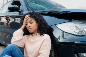 sad woman regretting car accident