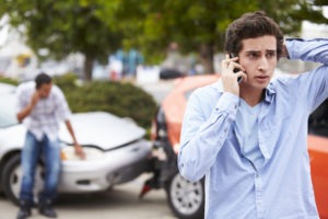 stressed driver making a call after a crash