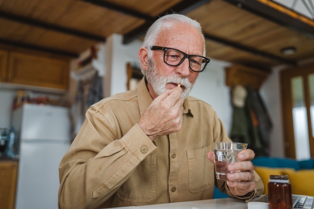 old man sitting alone in nursing home