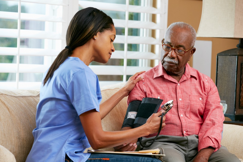 older black man being cared for in a nursing home